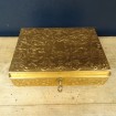 Musical jewellery box in embossed golden leather
