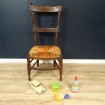 Old "nanny" chair low straw & coloured