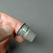 Old silver thimble with Greek pattern & badge