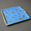 Flat ashtray pocket holder with gold flowers on a blue background