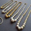 B57 - Old falling ivory (or bone) pearl necklace