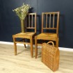 Pair of wooden straw chairs by A. VILLEMINOT