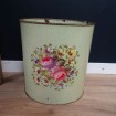 Old metal dustbin with flowers decoration