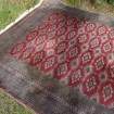 Large antique Iranian carpet in burgundy tones