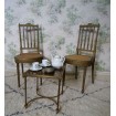 Pair of Louis XVI chairs in gilded wood and caned