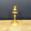 Old brass candleholder with engraved decoration