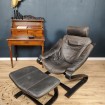 Black leather and wood armchair & footrest circa 1970