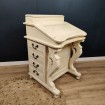 Small English Davenport writing desk with multiple cream drawers