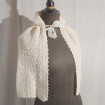 Hand knitted hooded cape for baby in the warmth