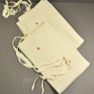 Antique cotton apron with red badge