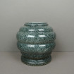 Vase in green mottled marble with a round, gadrooned design