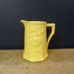 Pitcher in yellow faience
