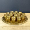 Tray with 14 golden brass liqueur glasses